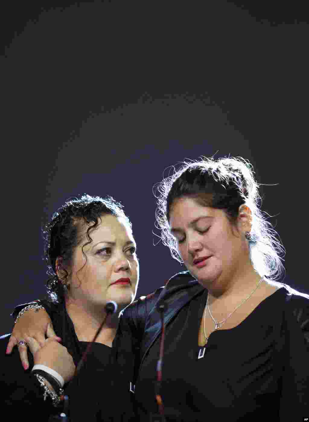 Hundreds of grieving family members and friends of the victims of the Malaysia Airlines Flight 17 disaster attend a commemoration ceremony at RAI in Amsterdam, Netherlands, Nov. 10, 2014.