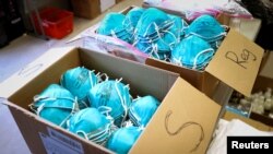 FILE - Boxes of protective masks are seen at a command center during the coronavirus outbreak in New Rochelle, New York, March 17, 2020. Malawi prison guards are demanding personal protective equipment against COVID-19.