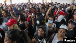People gather in the aftermath of the last days' protests, after the government of Ecuadorian President Lenin Moreno agreed to repeal a decree that ended fuel subsidies, in Quito, Ecuador October 14, 2019. REUTERS/Ivan Alvarado