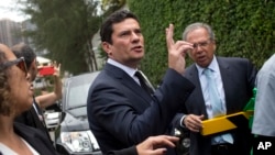 Judge Sergio Moro talks to the press as he exits a meeting with President-elect Jair Bolsonaro, outside Bolsonaro's home in Rio de Janeiro, Brazil, Nov. 1, 2018.