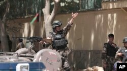 Afghan security forces near entrance gate of presidential palace in Kabul, June 25, 2013.
