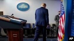 FILE - President Donald Trump walks away after speaking at the White House, in Washington, Nov. 5, 2020.