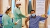 A man receives a vaccine as Cambodia starts its coronavirus disease (COVID-19) vaccine rollout with 600,000 doses of Sinopharm vaccine donated by China in Phnom Penh, Cambodia, February 10, 2021. (REUTERS/Cindy Liu)