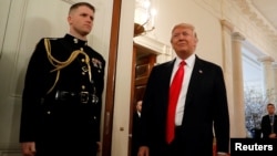FILE - U.S. President Donald Trump arrives for a National Governors Association meeting at the White House in Washington.