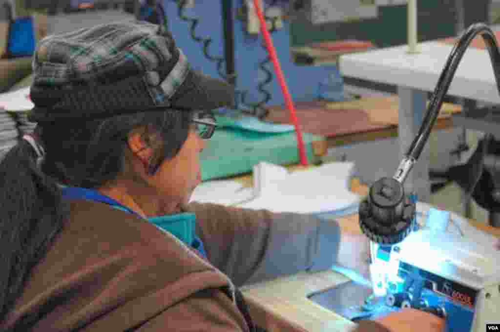 Dozens of countries are represented on the Danner factory floor, Portland, Oregon, Jan. 20, 2014. (Steve Herman/VOA)