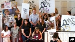 Vicky Chavez, center, speaks during a news conference while supporters look on at the First Unitarian Church in Salt Lake City, July 9, 2018. Chavez, a Honduran woman who has been taking sanctuary with her two daughters in the church for the past six months, is vowing to fight for her asylum case and seek relief from a federal appeals court.