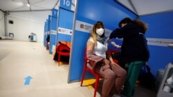 A medical worker injects the AstraZeneca coronavirus vaccine at Fiumicino Airport in Rome, Italy, March 8, 2021.