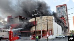 Smoke billows from the Casino Royale in Monterrey, Mexico, August 25, 2011