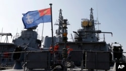 FILE - Montenegrin sailors are seen aboard the frigate "Kotor" in the harbor of Bar, Montenegro, March 15, 2017. Montenegro is set to become NATO’s newest member after the U.S. Senate voted overwhelmingly March 28 to ratify the tiny Balkan nation’s entry into the alliance.