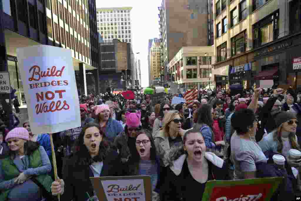 Protesters rally against President Donald Trump during a women's march Saturday, Jan. 21, 2017, in Chicago. The march is being held in solidarity with similar events taking place in Washington and around the nation. (AP Photo/Paul Beaty)
