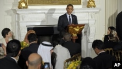 US President Barack Obama celebrates the Islamic holy month of Ramadan by hosting an iftar dinner in the State Dining Room of the White House in Washington, August 10, 2012. 