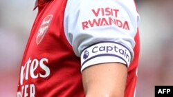 FILE- The "Visit Rwanda" logo is seen on the sleeve of Arsenal's Norwegian midfielder Martin Odegaard during a club friendly football match between Arsenal and Sevilla at the Emirates Stadium in London. July 30, 2022. 