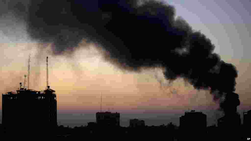 Smoke raises over Gaza City after an Israeli airstrike, Aug. 10, 2014.