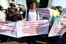 A Myanmar nationalist group gathers to protest against Gambia and Organization of Islamic Cooperation for accusing Myanmar of committing genocide over Rohingya minority in Rakhine state in Yangon, Myanmar, Nov. 25, 2019.