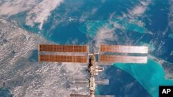 The International Space Station is seen over Miami, Florida, in this 35mm frame photographed by STS-108 Commander DomInic Gorie aboard the Space Shuttle Endeavour (file photo)