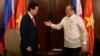 Philippines' President Benigno Aquino (R) prepares to shake hands with Vietnam's Prime Minister Nguyen Tan Dung during during their meeting at the Malacanang Presidential Palace in Manila, May 21, 2014.