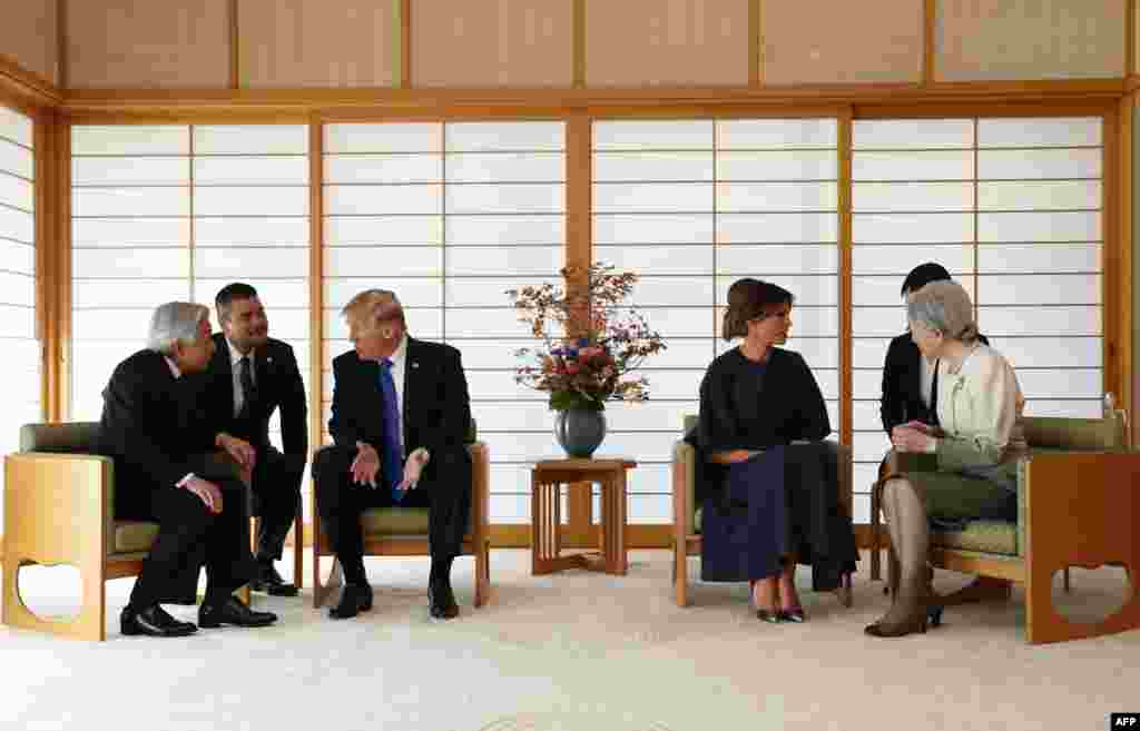 U.S. President Donald Trump talks with Japan's Emperor Akihito while his wife Melania talks with Empress Michiko at the Imperial Palace in Tokyo, Nov. 6, 2017.