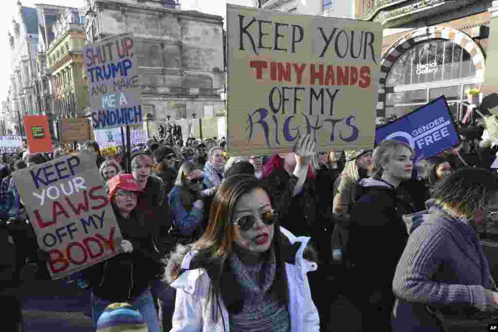 Demonstrators take part in the Women's March on London, following the Inauguration of U.S. President Donald Trump, in London, Jan. 21, 2016. (AP Photo/Tim Ireland)