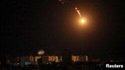 An explosion of a drone is seen in the sky over the city during a Russian drone strike, amid Russia's attack on Ukraine, in Kyiv, Ukraine May 8, 2023. 