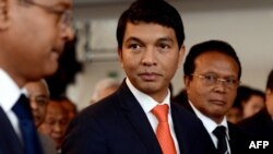 Madagascar's transitional leader Andry Rajoelina (C) attends a ceremony at Antananarivo's Town Hall to commemorate the students' unrest in 1972 which led to the first Republic's fall, May 13, 2013. 