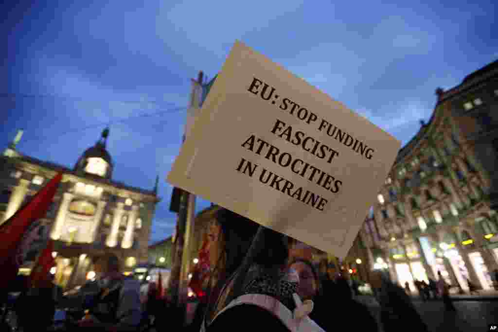 People stage a protest against the Ukrainian government, Milan, Italy, Oct. 16, 2014.