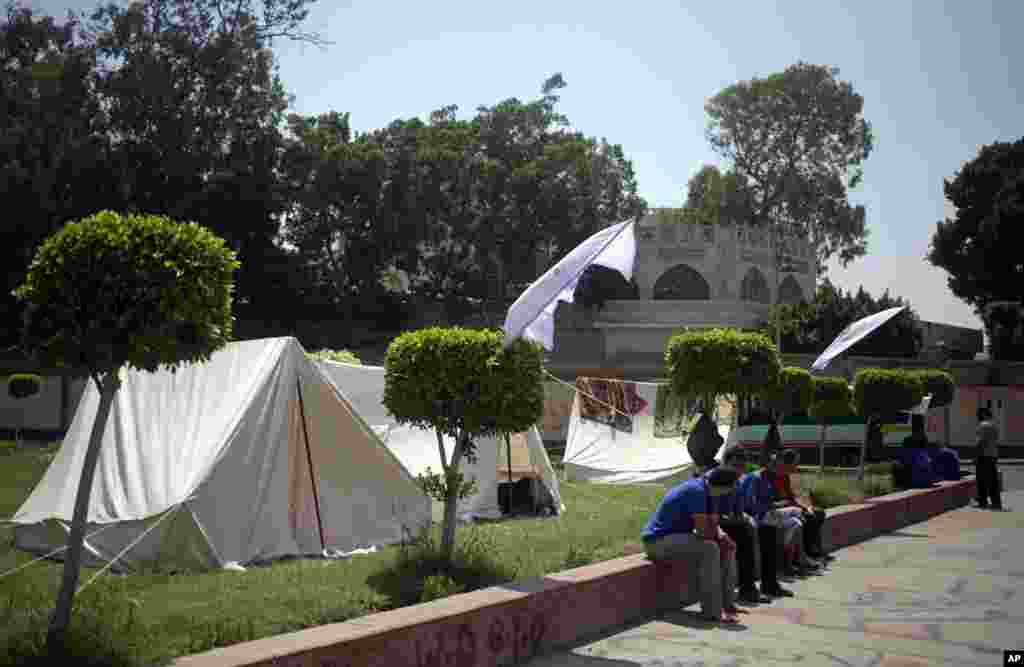 Opponents of Egypt's Islamist President Mohamed Morsi camp outside the presidential palace ahead of mass protests in Cairo, June 28, 2013.