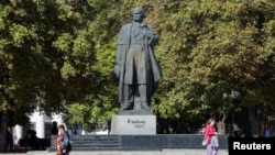 Pedestrians walk in Luhansk