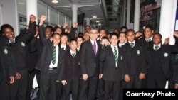 Sadiq Khan gathers with current students during a 2011 visit to his school in London's ethnically diverse Tooting neighborhood. (Photo courtesy of Ernest Bevin College)