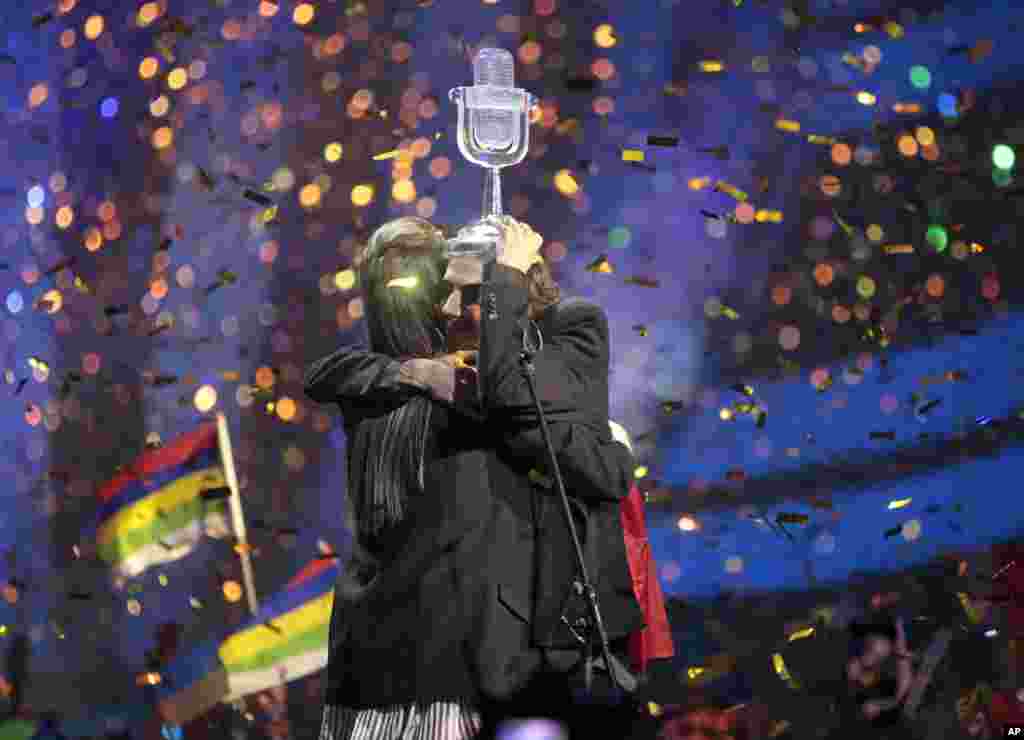 Salvador Sobral from Portugal, right, embraces his sister Luisa after performing the song "Amar pelos dois" following his win in the Final of the Eurovision Song Contest, in Kyiv, Ukraine, May 13, 2017.