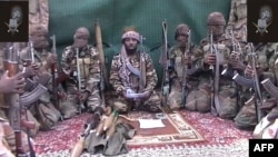 FILE - Abubakar Shekau, who claims to be the leader Boko Haram, is seen in a video screen grab, at an unknown location, Sept. 25, 2013.