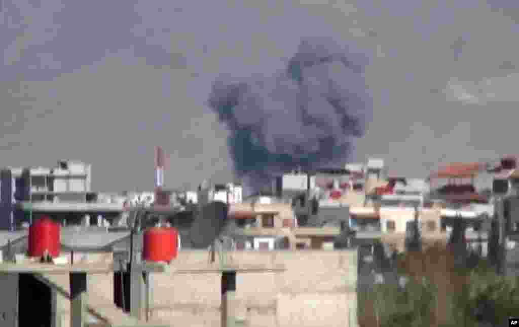 This image taken from video obtained from the Shaam News Network shows what was said to be heavy shelling by warplanes near Damascus, Syria, December 10, 2012.