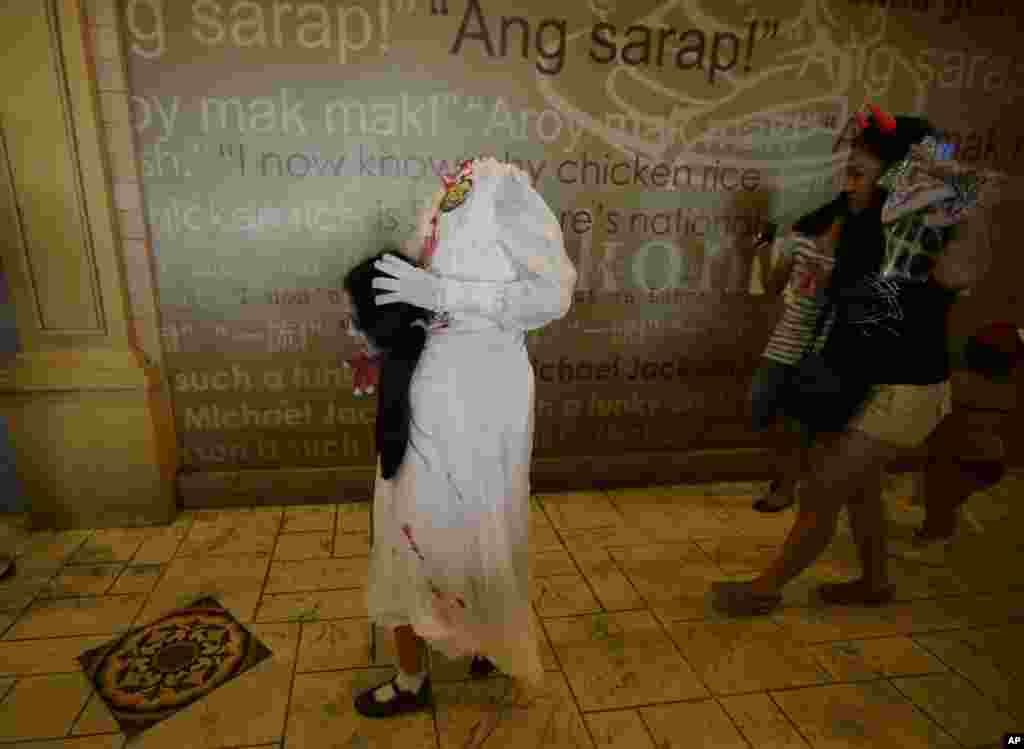 Children dressed in costumes take part in Manila's Ocean Park annual Trick or Treat event, Philippines.