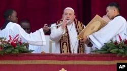 Pope Francis delivers the Urbi et Orbi (Latin for 'to the city and to the world' ) Christmas' day blessing from the main balcony of St. Peter's Basilica at the Vatican, Dec. 25, 2024. 