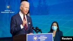 Congresswoman Deb Haaland, U.S. President-elect Joe Biden's nominee for the Interior Secretary, listens as U.S. President-elect Joe Biden introduces key members of their administration in Wilmington, Delaware, U.S., December 19, 2020. REUTERS/Kevin Lamarq