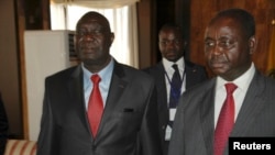 Djotodia, left, leader of the Seleka rebel alliance, beside now-exiled CAR President Francois Bozize, Libreville, Jan. 11, 2013.