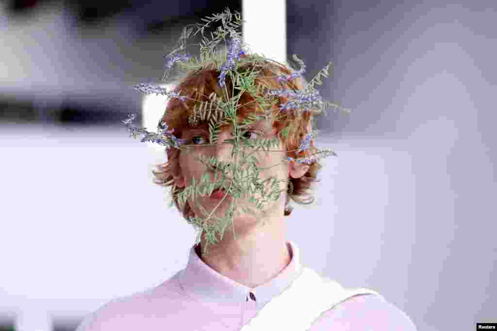 A model presents a creation by designer Satoshi Kondo as part of his Spring/Summer 2025 Women's ready-to-wear collection show for fashion house Issey Miyake during Paris Fashion Week in Paris, France.