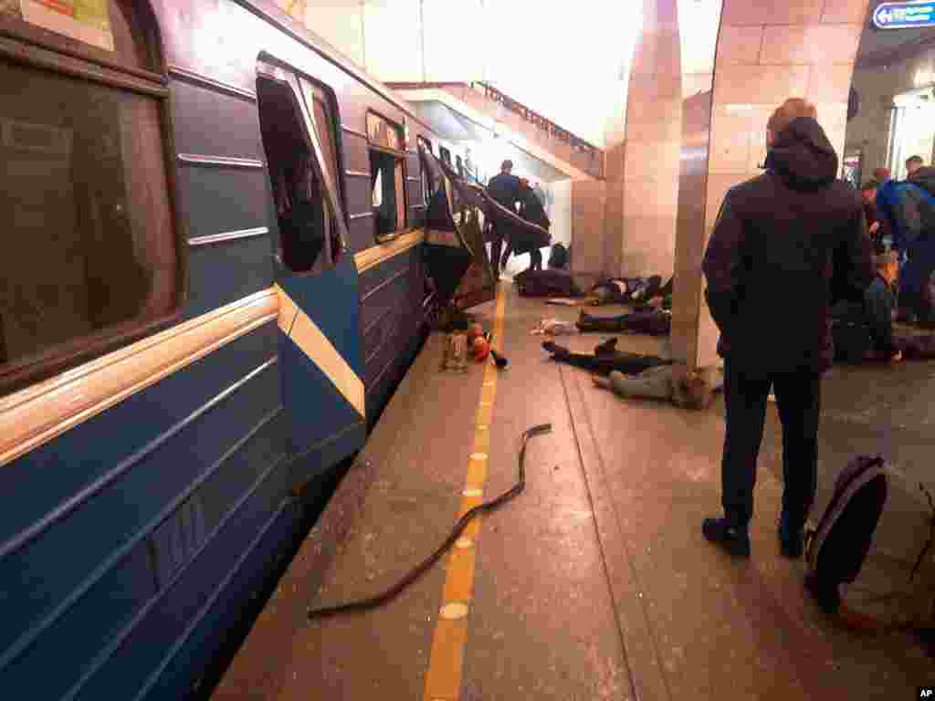 Blast victims lie near a subway train hit by a explosion at the Tekhnologichesky Institut subway station in St.Petersburg, Russia, April 3, 2017.