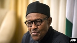 FILE - Nigerian President Muhammadu Buhari gives an interview to Agence France-presse at his hotel during the 25th African Summit, Johannesburg, South Africa, June 14, 2015