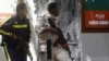 Somali policemen hold their positions near the mayor's office following a blast in Mogadishu, Jan. 22, 2023. 