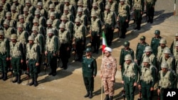 FILE - In this photo from the Islamic Revolutionary Guard Corps' Ground Force on Oct. 17, 2022, troops stand while attending a maneuver in northwestern Iran.