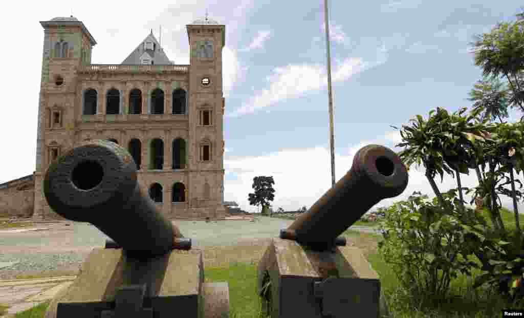At the entrance of Madagascar's Queen Palace, also called ----Rova, stand old cannons. The landmark is located at the top of Analamanga hill and stands out in the skyline of the city.