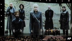 FILE - "Game of Thrones" cast and crew members accept the Emmy Award for Best Drama onstage at the 70th Primetime Emmy Awards in Los Angeles, Sept. 17, 2018.