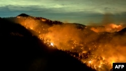 The Bobcat Fire continues to burn through the Angeles National Forest in Los Angeles County, north of Azusa, California, Sept. 17, 2020.