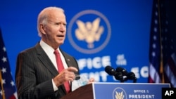 FILE - President-elect Joe Biden speaks at The Queen theater in Wilmington, Del., Nov. 19, 2020.