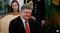 FILE - Ukraine's President Petro Poroshenko is seen in a meeting with Singapore's President Tony Tan, Tuesday, Dec. 9, 2014.