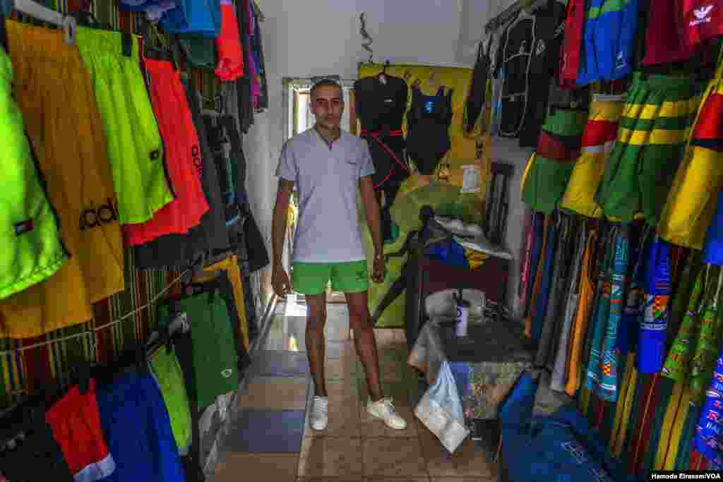Tharwat Betash, a 21-year-old salesman in Alexandria, Egypt, says 'I used to sell triple the amount on display now during a weekend, but now I have been trying to sell this merchandise for the last two weeks. (Hamada Elrasam/VOA)