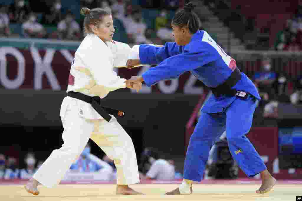 Paula Pareto of Argentina, left, and Geronay Whitebooi of South Africa compete during their women's -48kg round of 32 judo match at the 2020 Summer Olympics, Saturday, July 24, 2021, in Tokyo, Japan. (AP Photo/Vincent Thian)