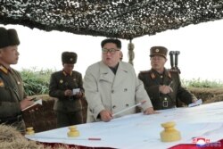 North Korean leader Kim Jong Un visits the Changrindo defensive position on the west front, in this undated picture released by North Korea's Central News Agency (KCNA), Nov. 25, 2019.