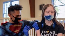 Kira Lundell, 16, who is on the autism spectrum, receives a coronavirus disease (COVID-19) vaccine at Variety - the Children’s Charity of the Delaware Valley.
