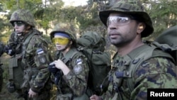 Estonia's Defense League volunteer soldiers attend a training drill near Rabasaare, Estonia, Sept. 12, 2015. 
